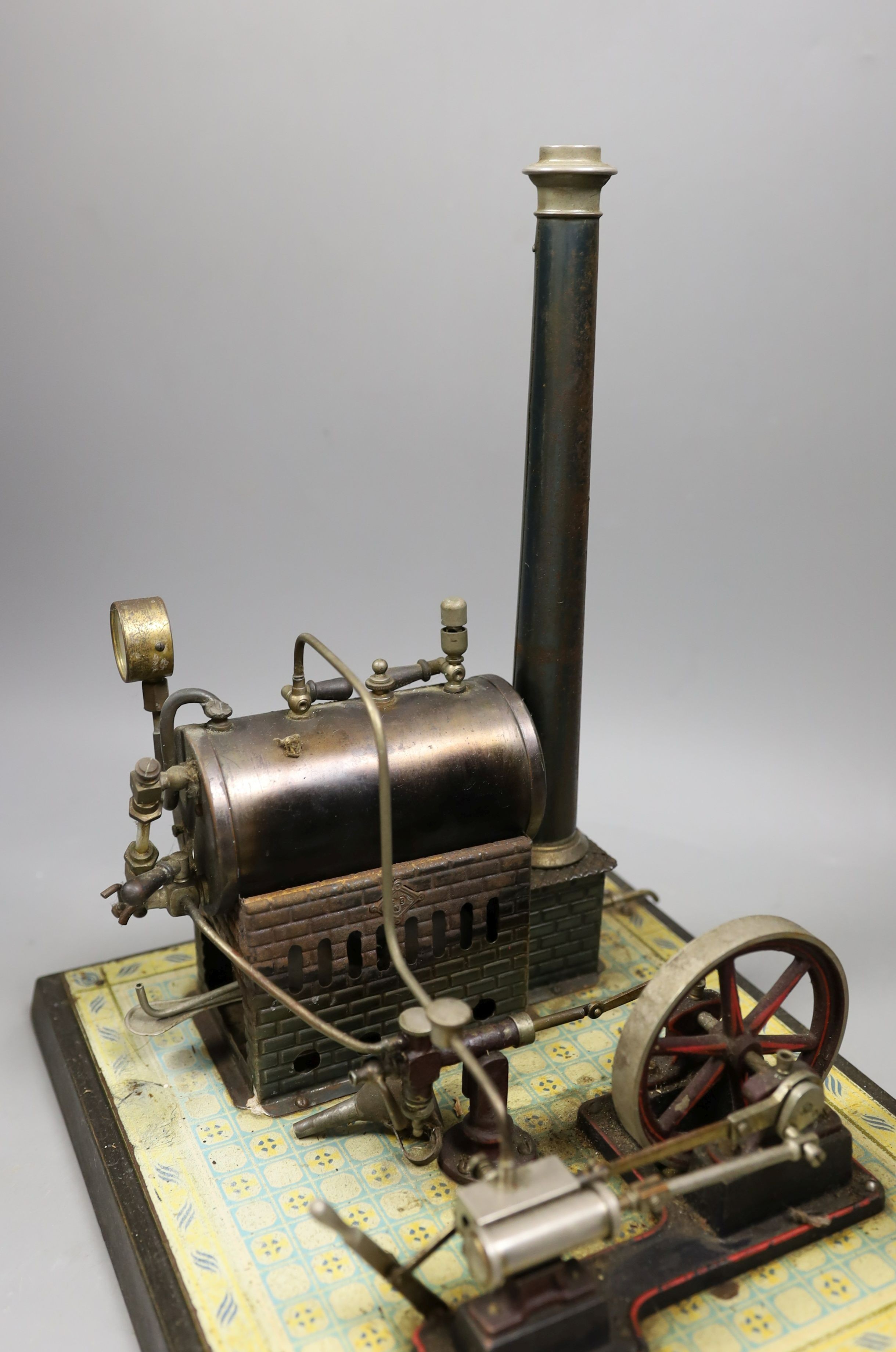 Gebruder Bing - tinplate stationary steam plant, single cylinder, rare, in original pine box, and grindstone accessories, 32cms high, width - 16cm, length - 29cm